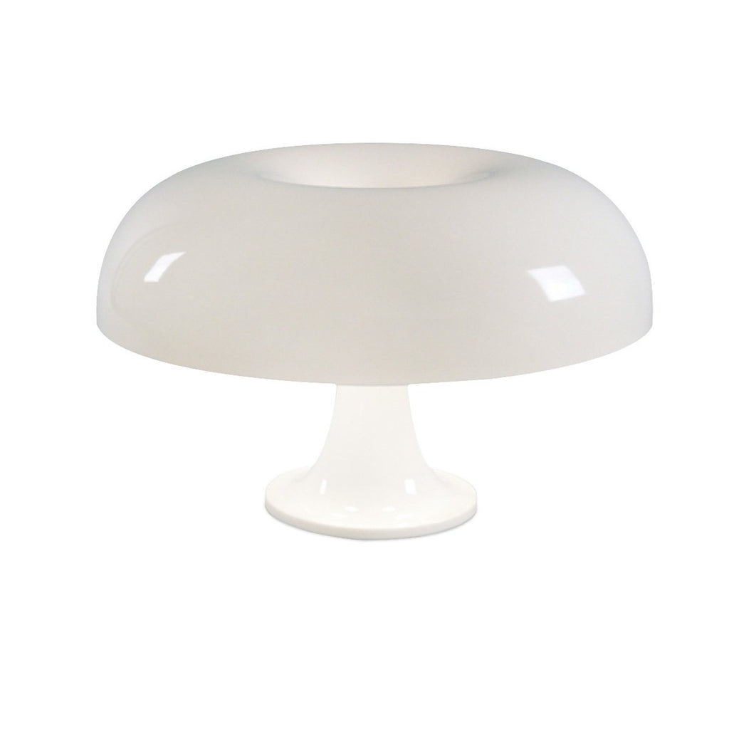 Lampe de chevet forme champignon blanche posée sur une table de nuit